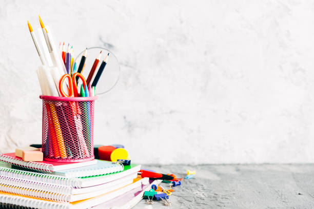 Photo of some notebooks, and a pencil holder.