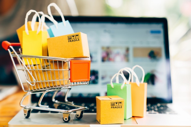 A miniature shopping cart and packages.